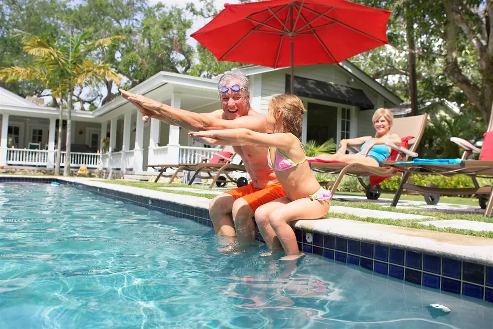 a person and a child in a pool