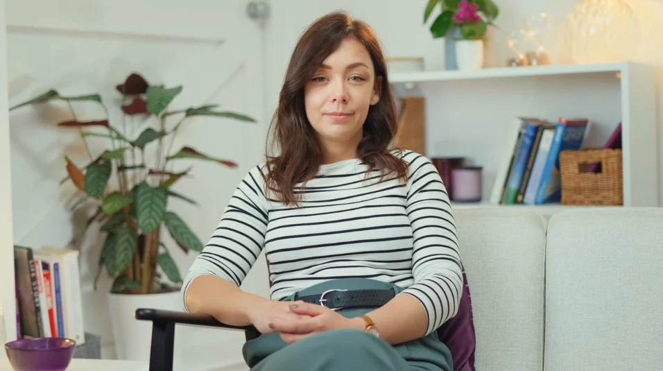 a woman sitting on a couch